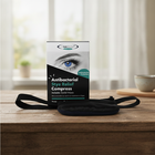 Antibacterial Stye Relief Compress packaging on a wooden surface with a blurred indoor background