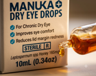 Close-up of a Manuka Dry Eye Drops box with amber liquid being poured from a glass dropper bottle, on a warm beige background.