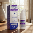 Optase Life Sensitive Eye Daily Renewal Cream shown with its retail box and pump bottle on a wooden tabletop in a softly lit indoor setting.