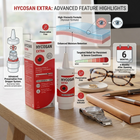 Hycosan Extra eye drops packaging and bottle displayed on a wooden desk with informational callouts, a calendar icon, and eyewear nearby. The image highlights product features such as preservative-free formula, high-viscosity formula, moisture retention, targeted relief, and a 6-month supply.