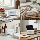 Four-panel collage showing VitroCap N supplement boxes placed in real home and office environments: on a kitchen counter, a wooden table by a couch, beside bathroom toiletries, and on a desk in front of a laptop.