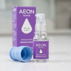 AEON REPAIR after sex surgery spray bottle with a purple label and a blue cap, shown next to its purple box on a light marble surface.