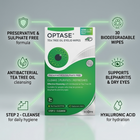 Optase Tea Tree Oil Eyelid Wipes box centered on a light gray background with green callout icons and text around it describing product benefits. The package is white and green with a teal-green circular eye graphic.