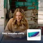 Smiling woman using her phone, with Precision1 pack inset