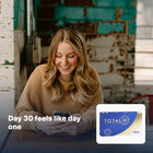 Smiling woman using her phone, with Total30 pack inset